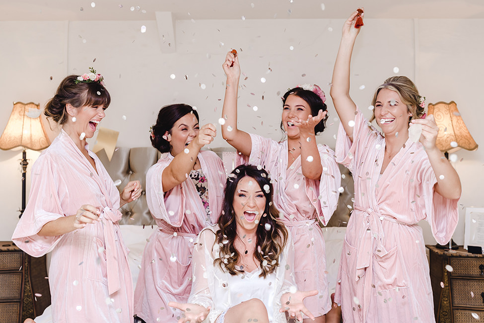 Happy Bridesmaids and bride on the morning of the wedding in South Wales