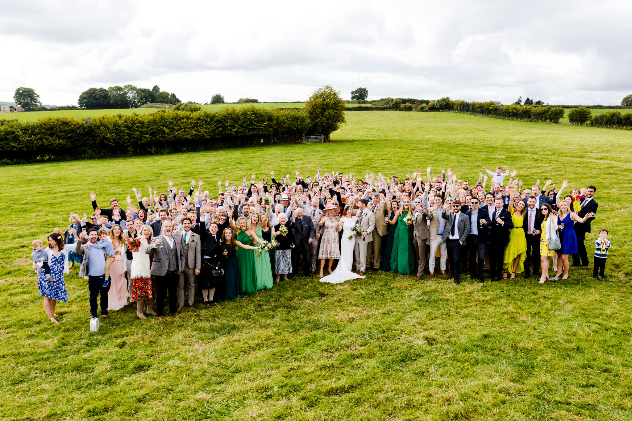 Wedding group photo in field