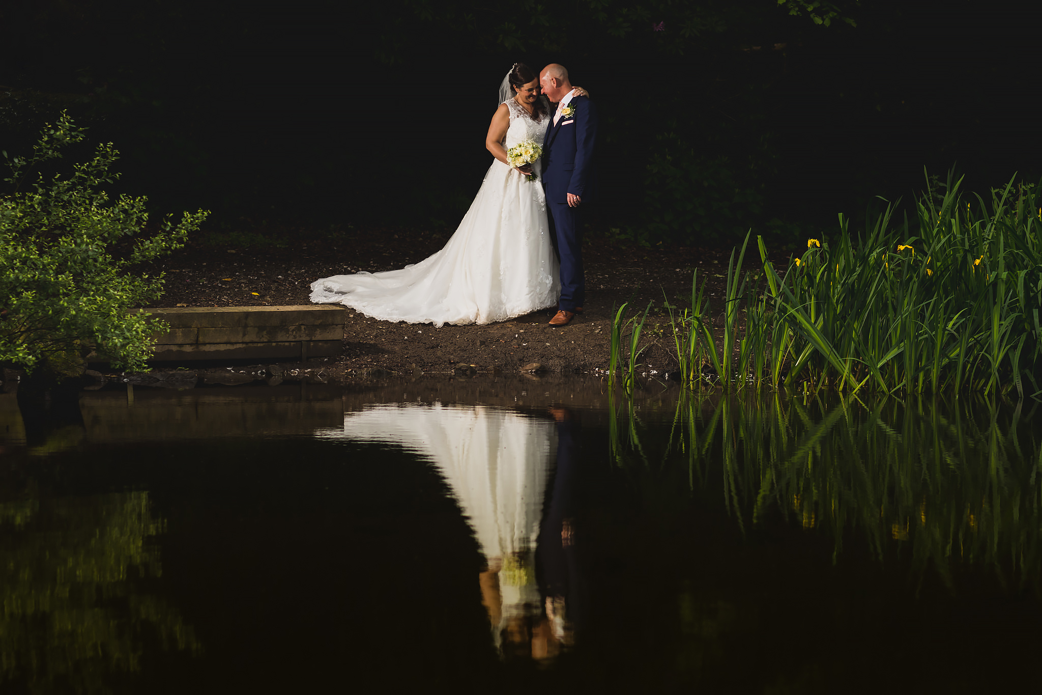 Bryngarw House wedding photography - Bride and Groom by the duck pond