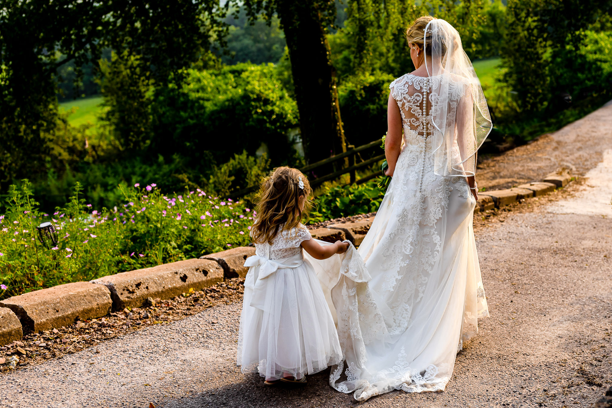 Art by Design - Caer Llan Wedding Photography - Bride and Flowergirl