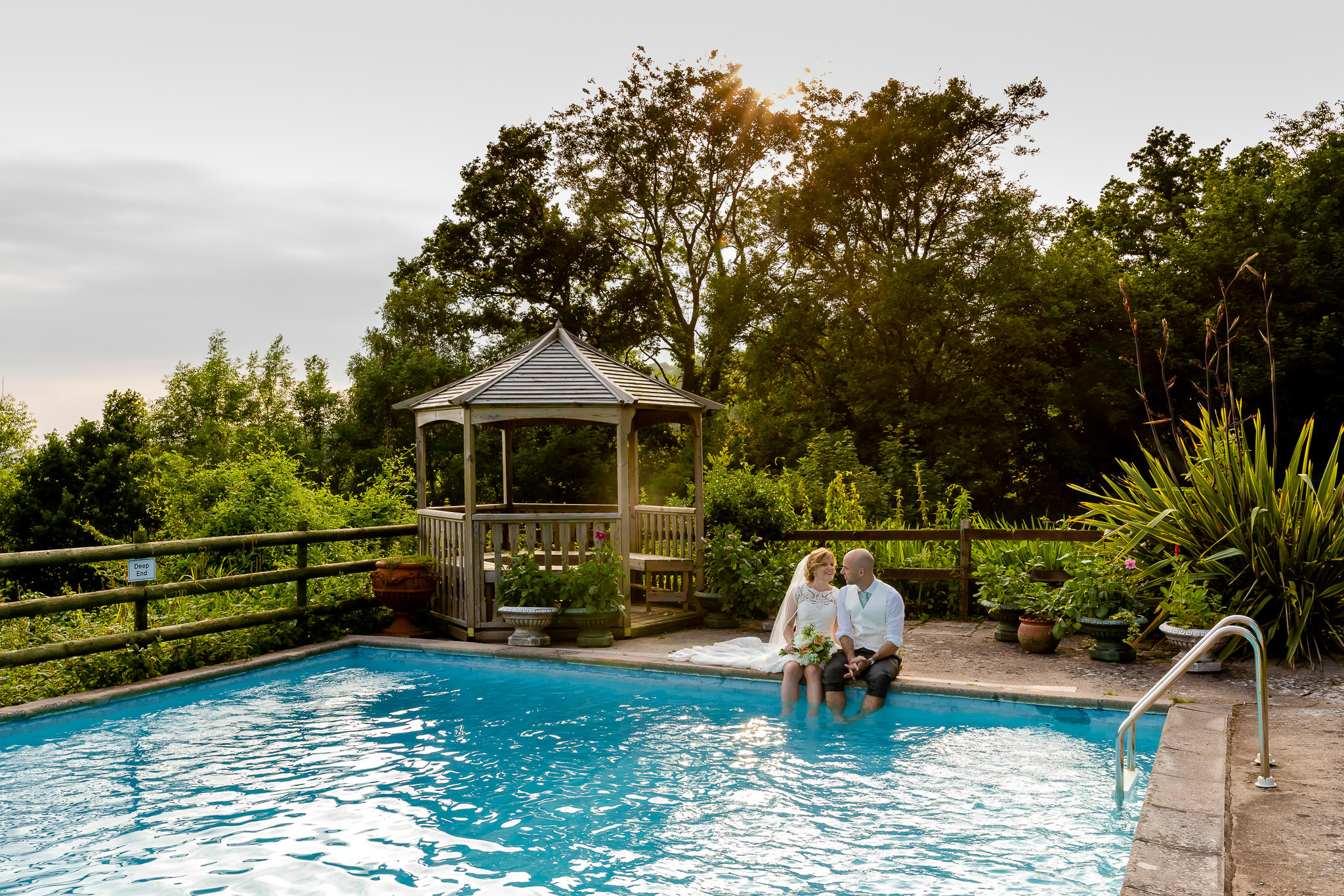 Art by Design - Caer Llan Wedding Photography - Bride and Groom in the pool
