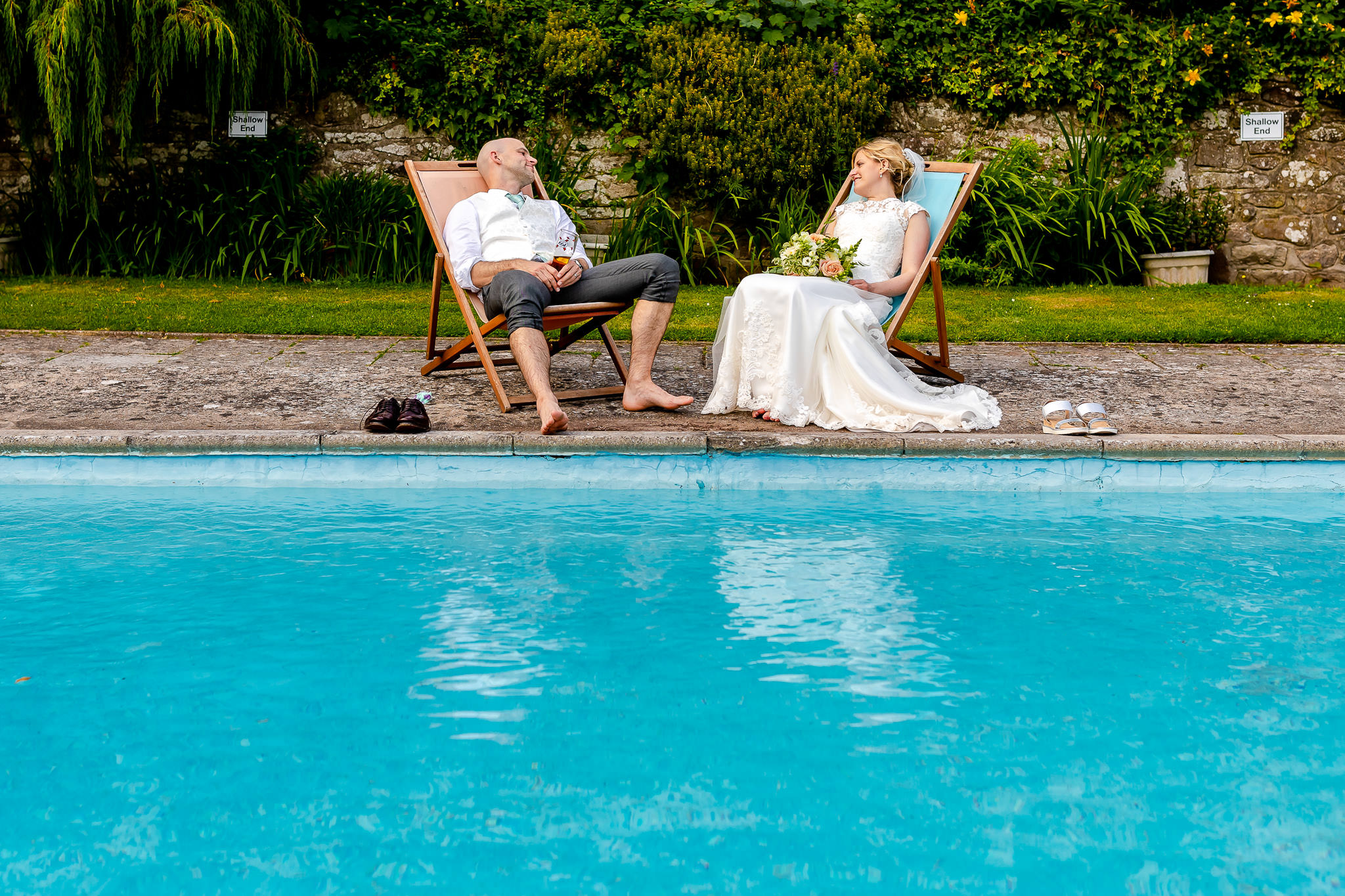 Art by Design - Caer Llan Wedding Photography - Bride and Groom by the pool