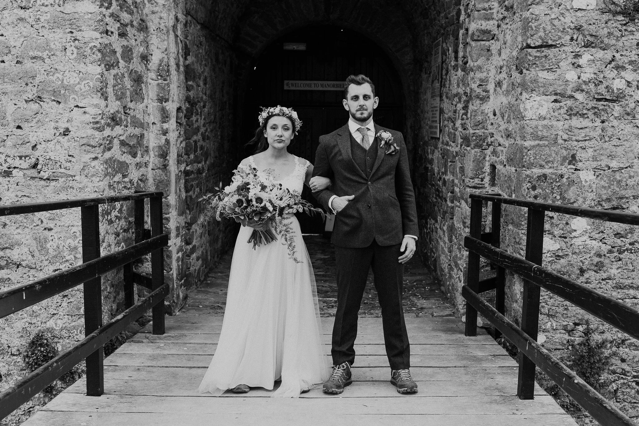Manorbier Castle Wedding - Bride and groom outside castle
