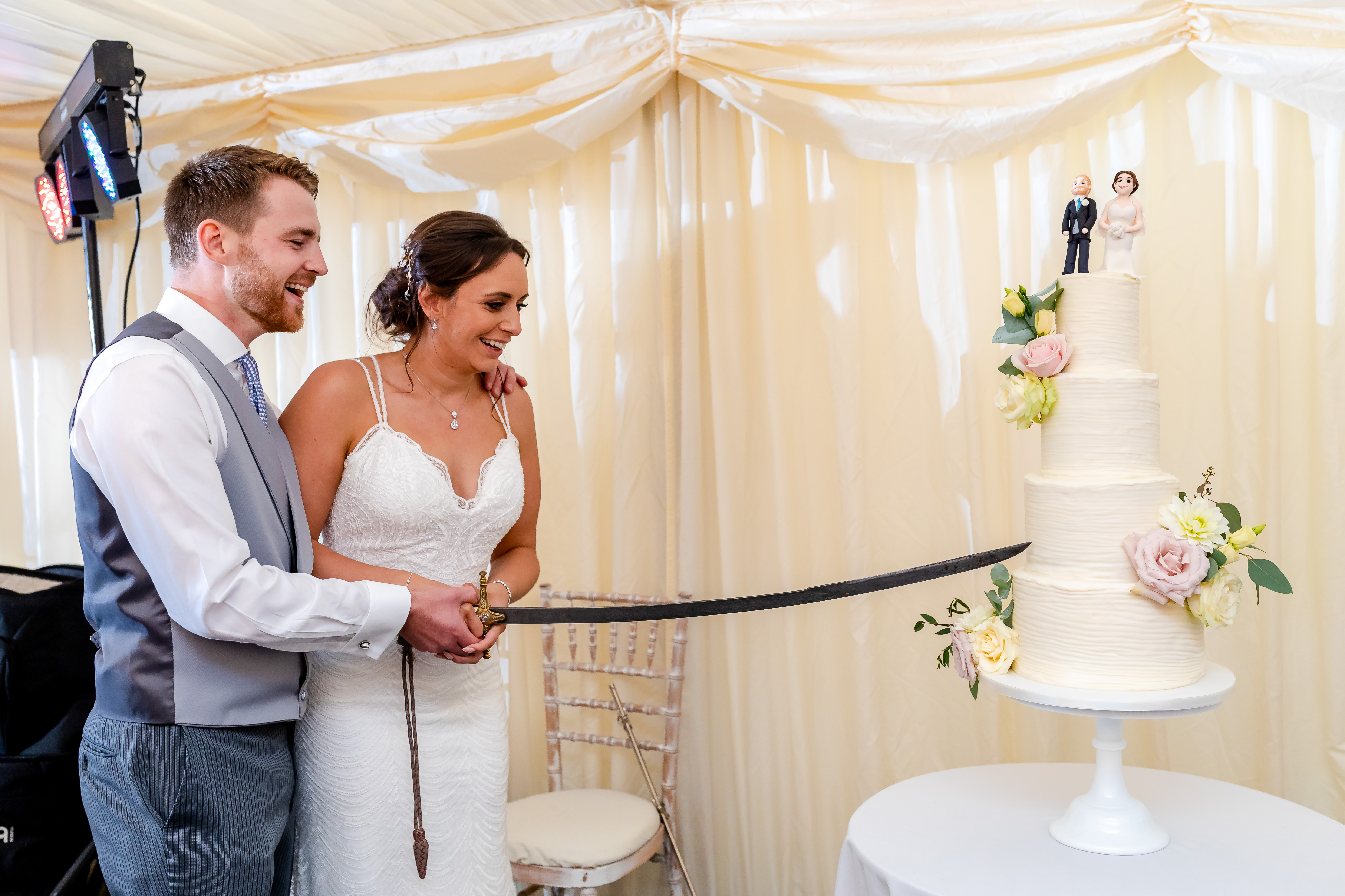 Fonmon castle wedding cutting the cake