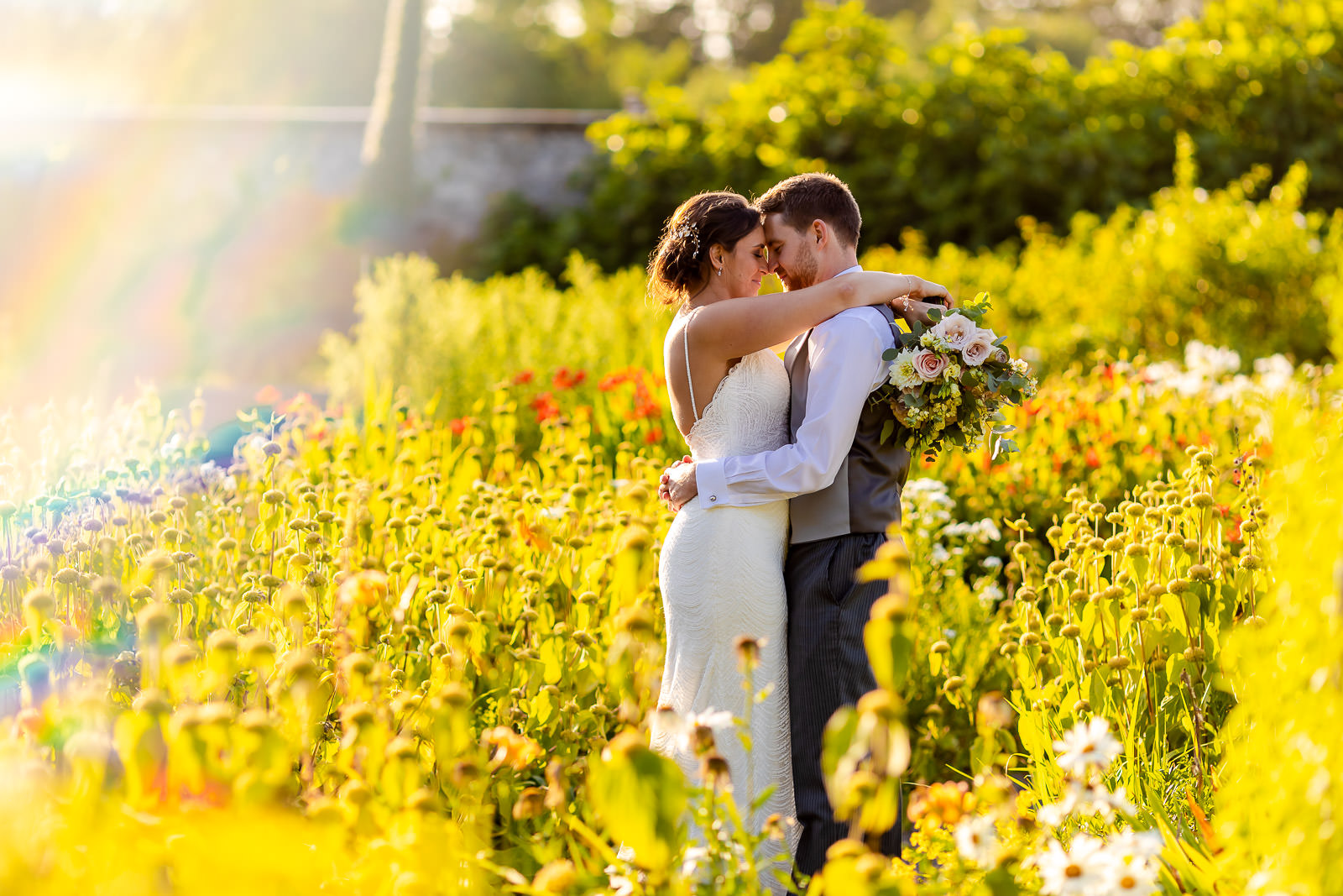 Fonmon Castle Wedding - Bride and Groom in flower garden - Cardiff Wedding Photographer