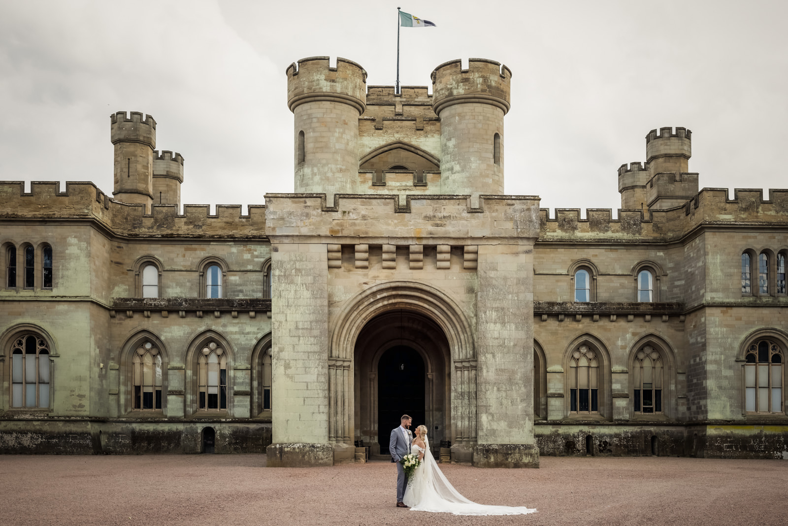 Eastnor Castle Wedding Photographer - Bride and Groom outside Eastnor Castle