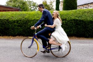Peterstone Court Wedding Photography - Bride and Groom on bike