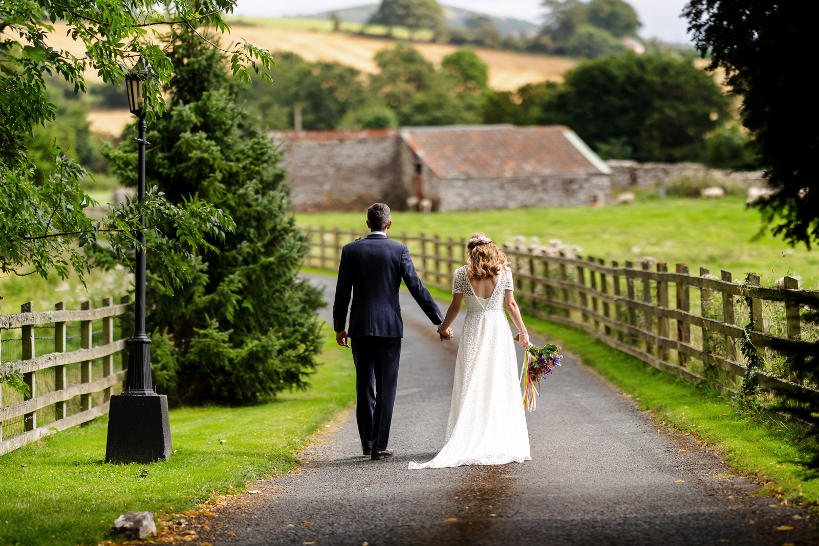 Peterstone Court Wedding Photography - Bride and groom going for a walk