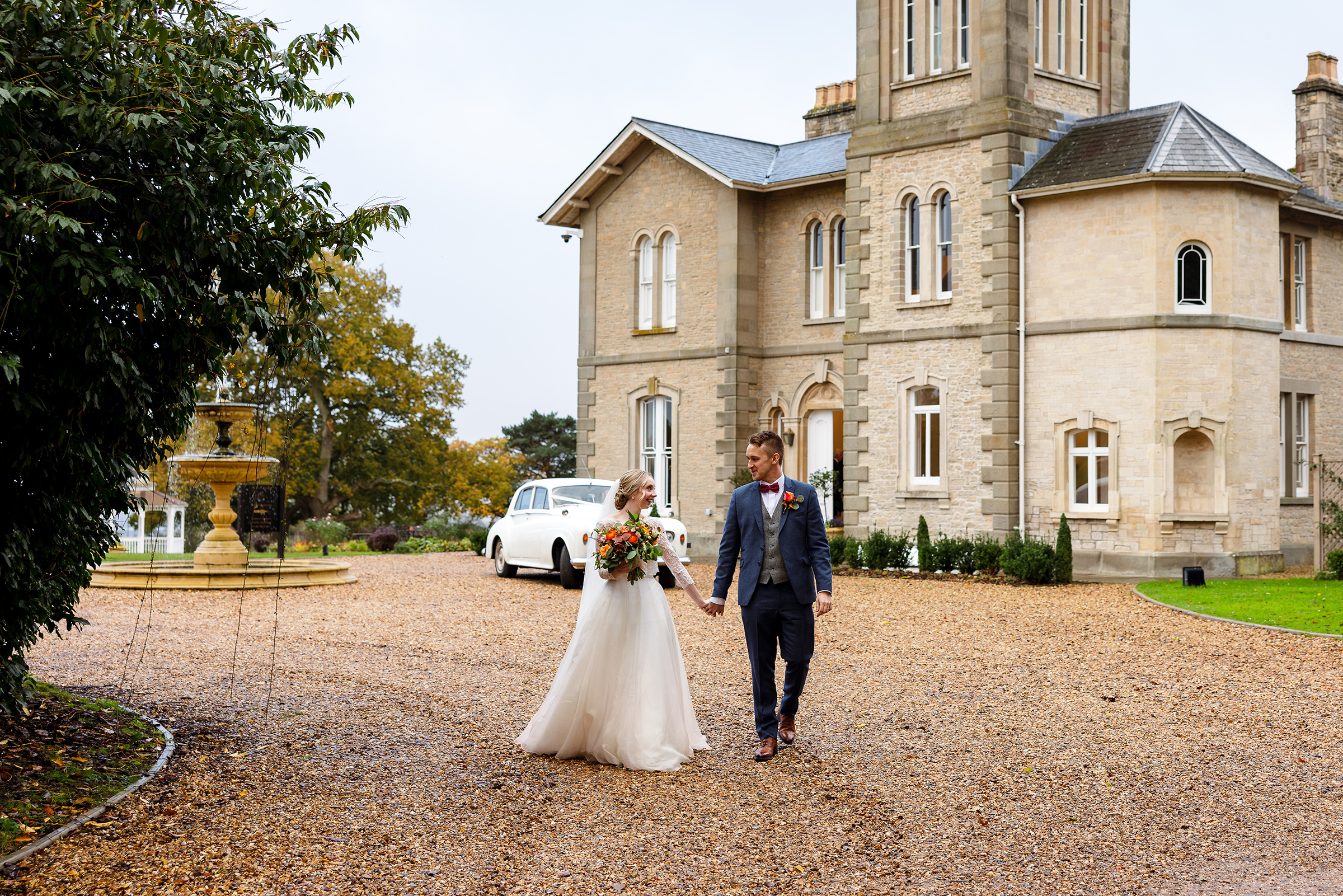 St Tewdrics House Wedding Photography - Bride and groom in front of St Tewdrics House