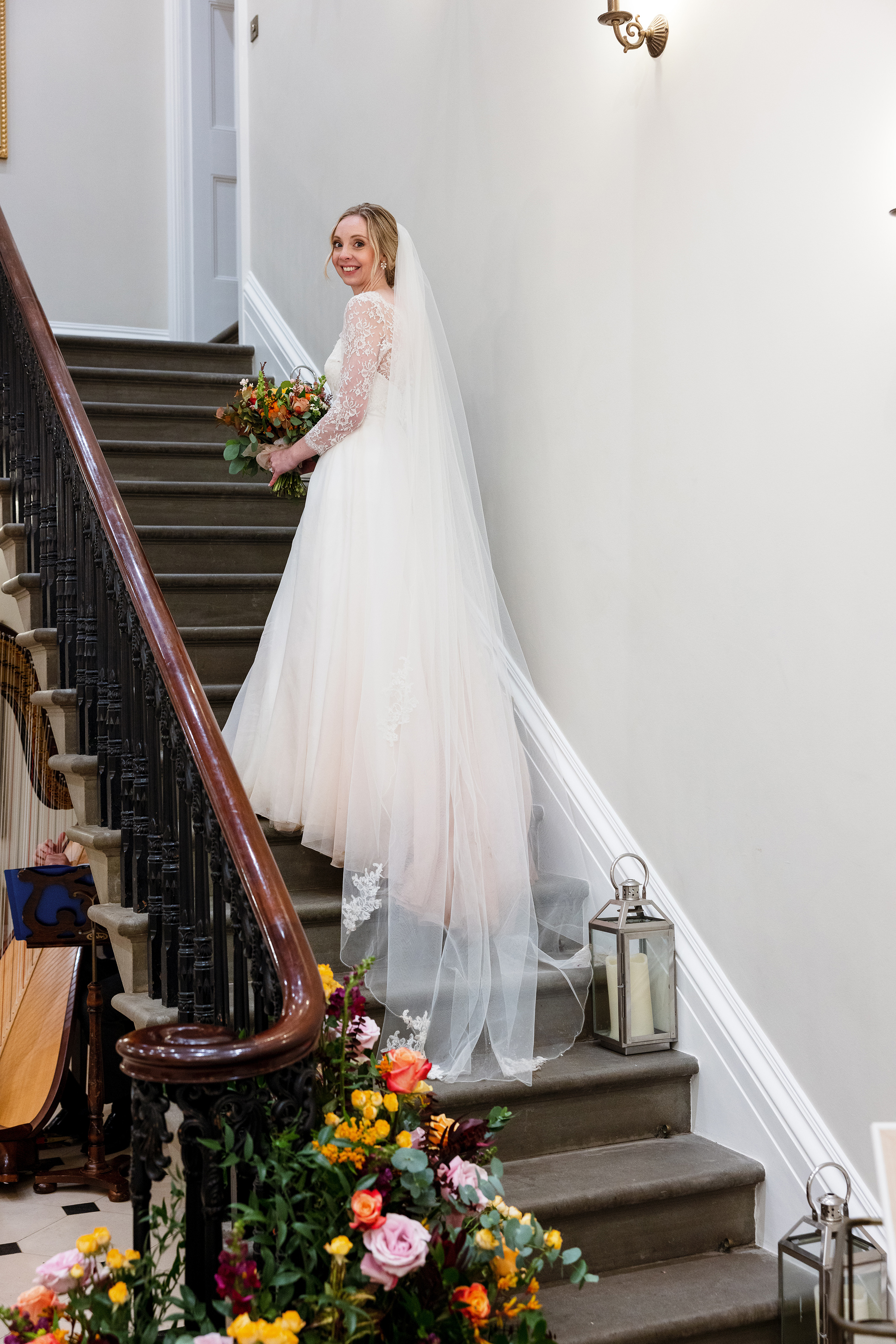 St Tewdrics House Wedding Photography - Bride on stairs