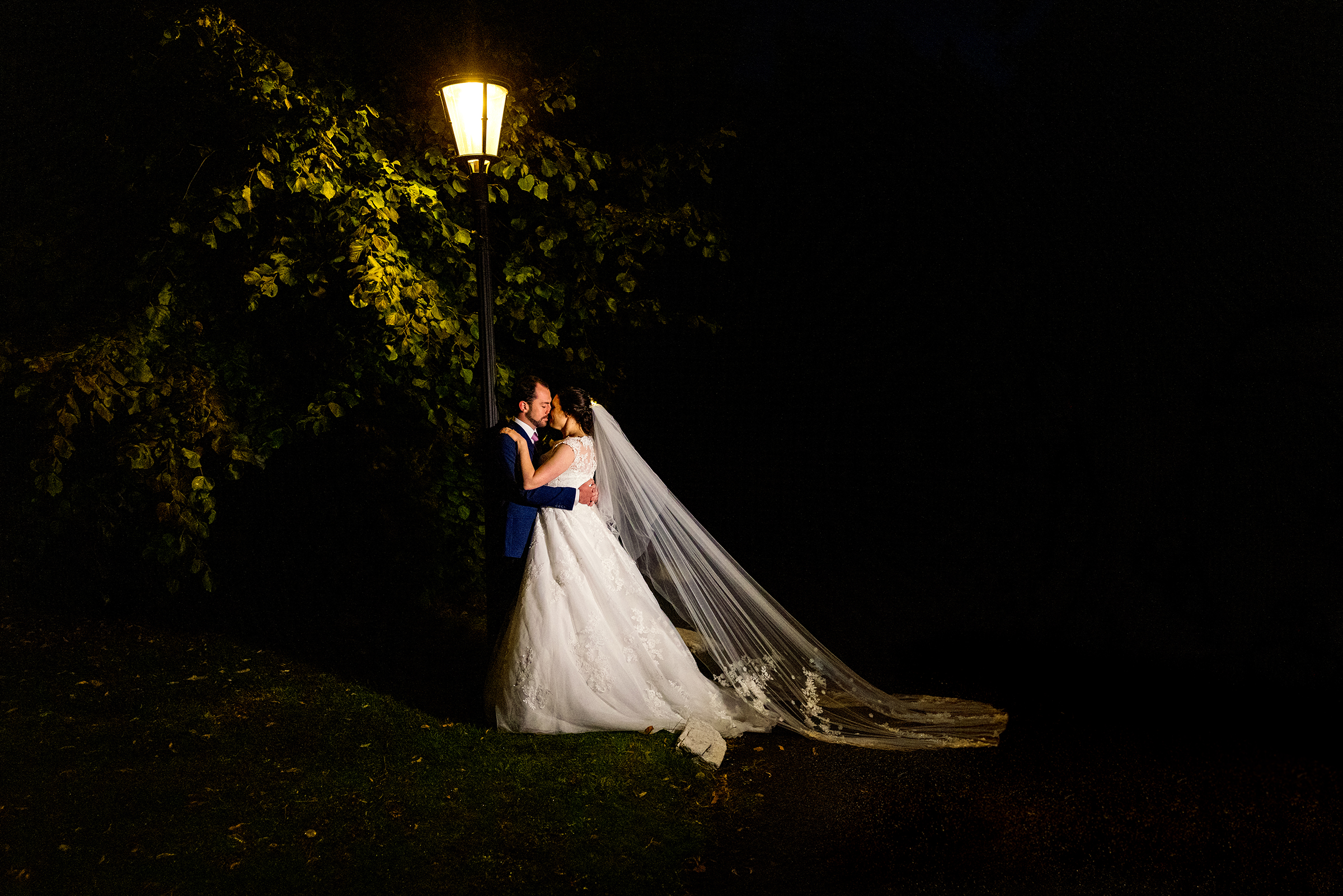 Peterstone Court Wedding - Bride and Groom under lamppost 