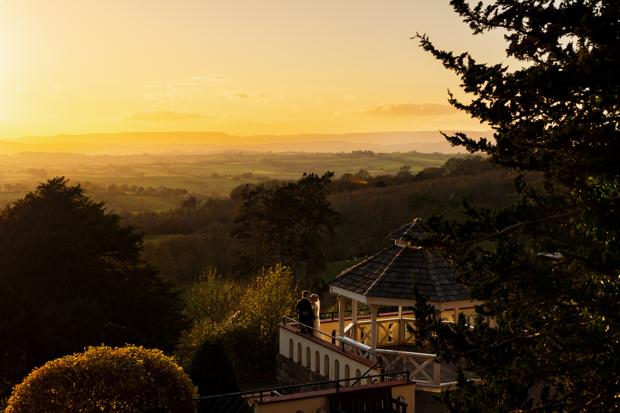 Caer Llan Wedding Photography- Sunset with bride and groom