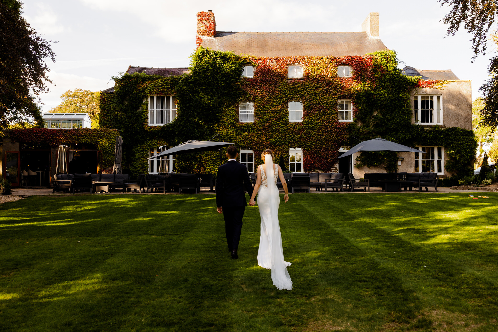 Fairyhill wedding photographer - Bride and Groom in front of House