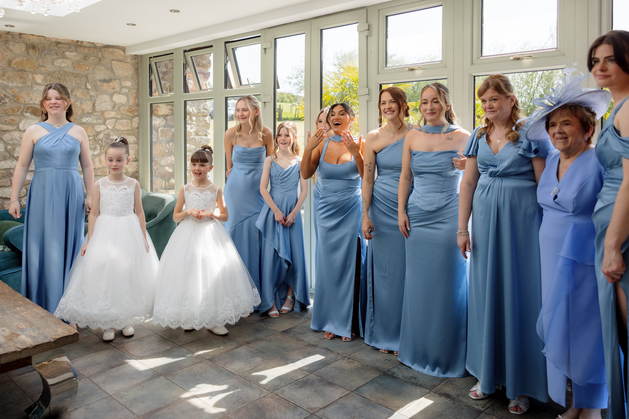 Fairyhill wedding photography - bride reveal to bridesmaids