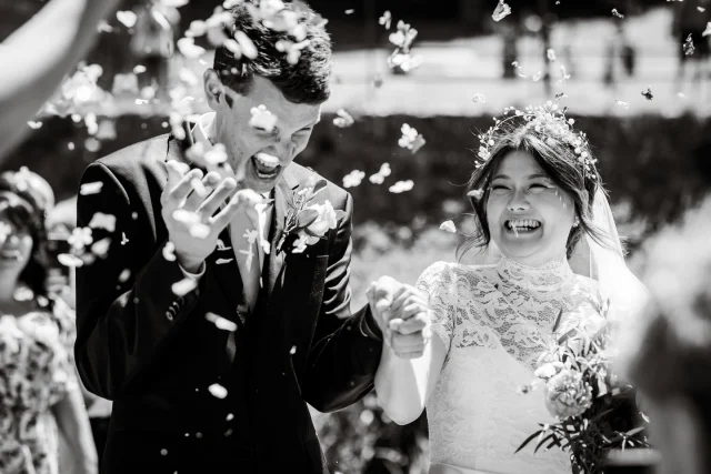 Happiness is getting smacked in the mouth with confetti. 

Natural & Candid wedding Photography in South Wales. Bride and Groom exit St David’s cathedral to a barrage of confetti from excitable guests.
 
#weddingconfetti #confettiphotos